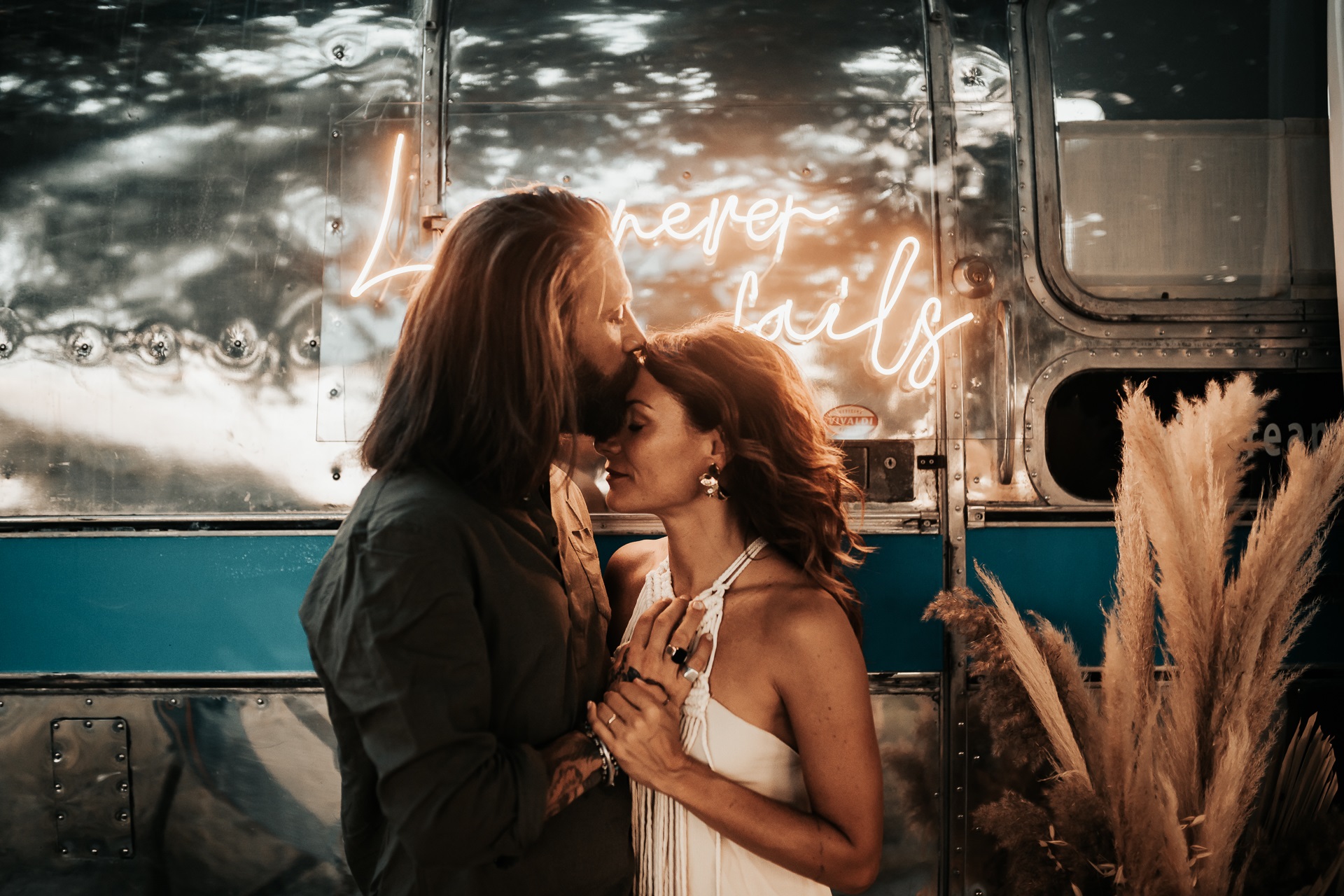 wedding couple boho styled shoot wedding vintage sign bride and groom boho wedding inspiration boho wedding ideas airstream wedding shoot